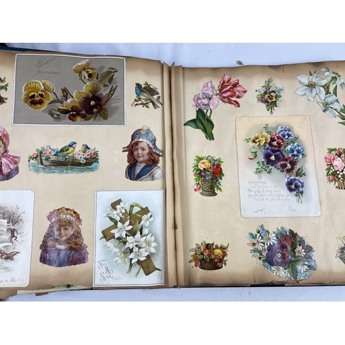 228 - A late Victorian scrap album with blue cloth cover and gilt detail, dated inside 1983. Containing as... 