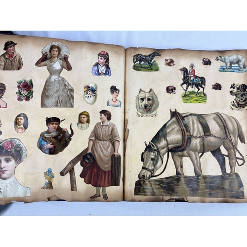 228 - A late Victorian scrap album with blue cloth cover and gilt detail, dated inside 1983. Containing as... 