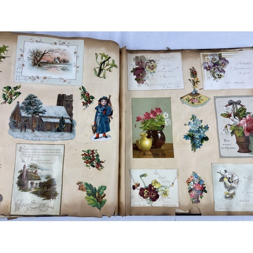 228 - A late Victorian scrap album with blue cloth cover and gilt detail, dated inside 1983. Containing as... 