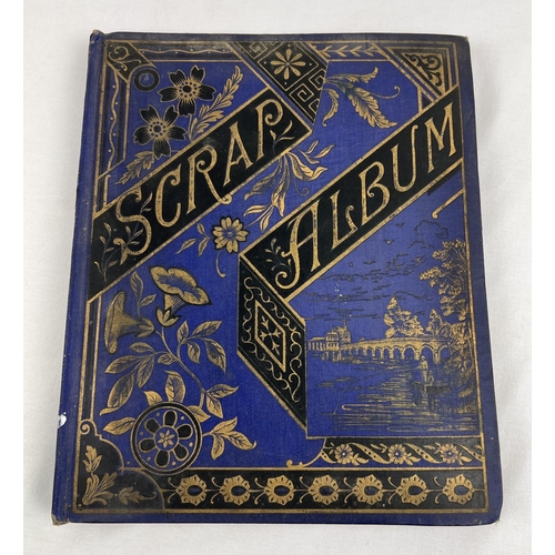 231 - A late Victorian scrap album containing greetings cards, silks and scraps. Album has navy blue cover... 