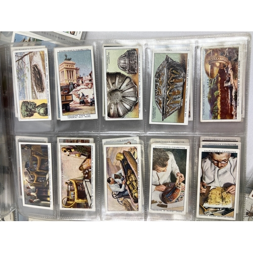 233 - A quantity of assorted Wills, Players & Churchmans cigarette cards, in clear plastic display sleeves... 