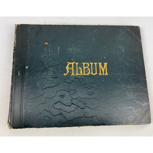 238 - A late Victorian album containing assorted scraps and period photographs.