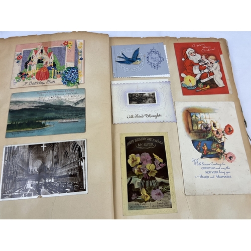 240 - A large Art Deco scrap album containing mostly greetings cards, but also postcards and scraps.