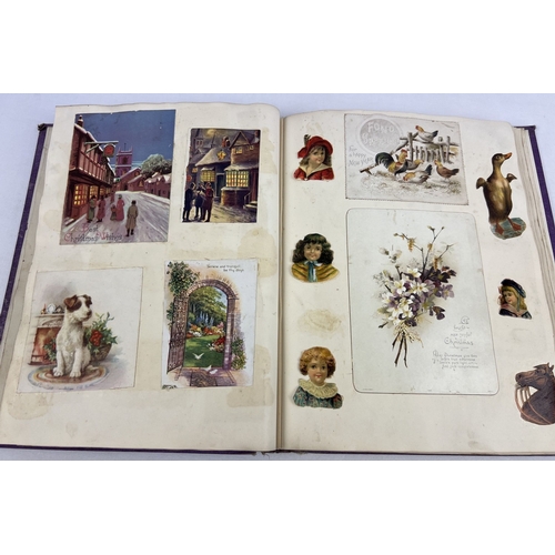 255 - A late Victorian scrap album containing assorted greetings cards, etchings and scraps to include ani... 