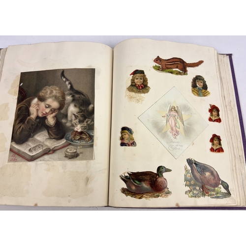 255 - A late Victorian scrap album containing assorted greetings cards, etchings and scraps to include ani... 