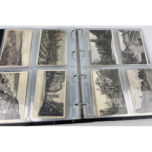 268 - A large black postcard binder containing 200+ assorted early 20th century British postcards to inclu... 