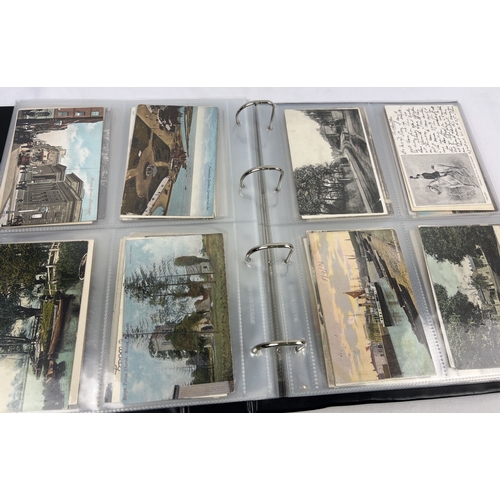 268 - A large black postcard binder containing 200+ assorted early 20th century British postcards to inclu... 