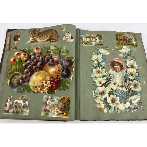 283 - A leather bounder Victorian scrap album (a/f) containing assorted greetings cards, coloured prints, ... 