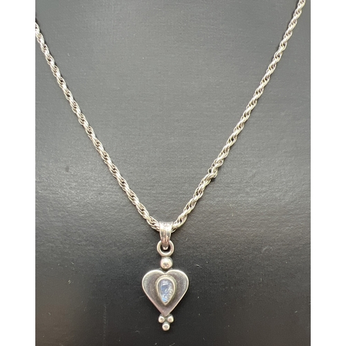 1036 - A silver modern design heart shaped drop pendant set with a cabochon of moonstone. On a 22