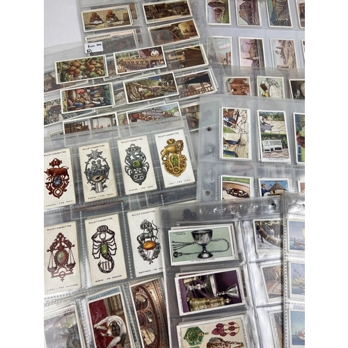 233 - A quantity of assorted Wills, Players & Churchmans cigarette cards, in clear plastic display sleeves... 