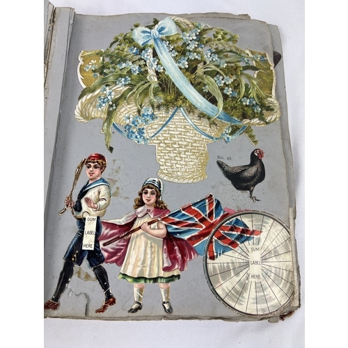 244 - An Edwardian scrap album of assorted prints, scraps, calendars and greetings cards. Some dated 1907.