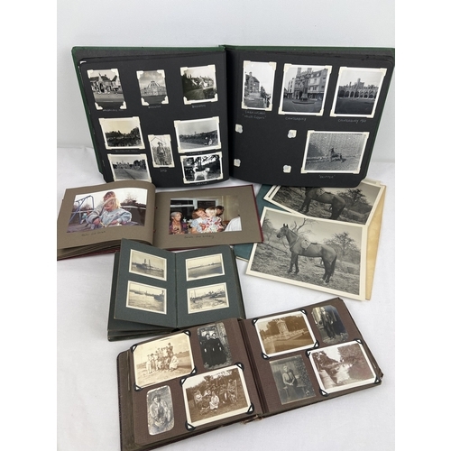 248 - A quantity of assorted vintage photograph albums containing images of animals, people in period dres... 