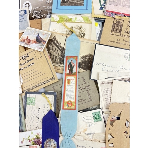 249 - A box of assorted early 20th century ephemera to include calendars, book marks, postcards, correspon... 