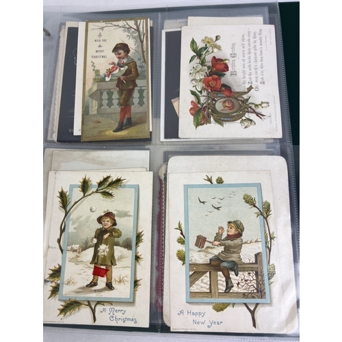 253 - An album containing 165 assorted Victorian & Edwardian greetings cards displayed in clear plastic en... 