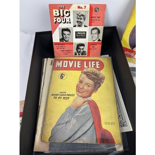 258 - A box of assorted vintage ephemera to include magazines, calendars, souvenir postcards and programme... 