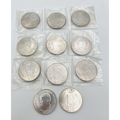 90 - 11 vintage Belgium silver 250 Franc Baudouin 25th Anniversary of Accession coins. In small box with ... 