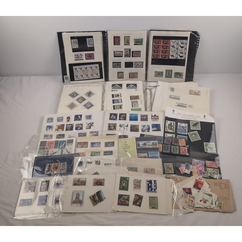 111 - A collection of individual stamp album sheets with various franked and unfranked stamps from around ... 