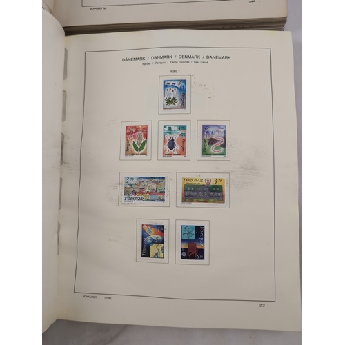 113 - 2 Schaubek Danmark stamp albums containing a quantity of Danish stamps in various conditions. Albums... 