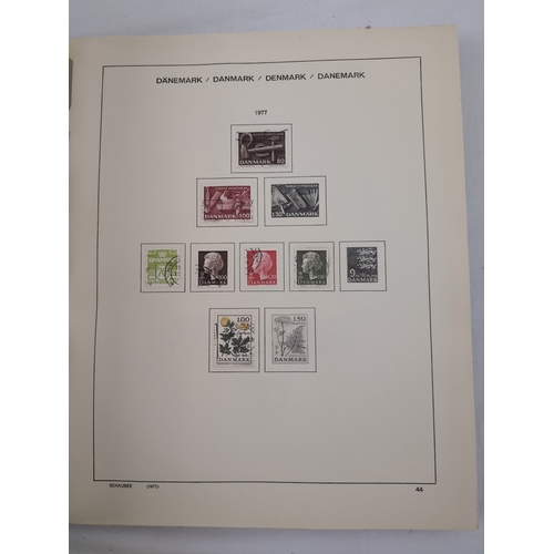 113 - 2 Schaubek Danmark stamp albums containing a quantity of Danish stamps in various conditions. Albums... 
