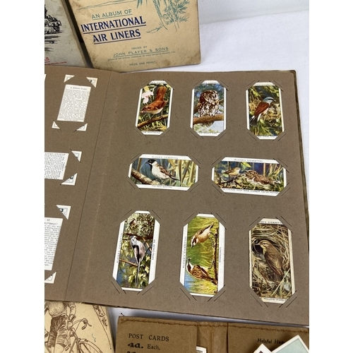 265 - A collection of assorted vintage cigarette cards and albums, to include Wills, John Players, Carrera... 