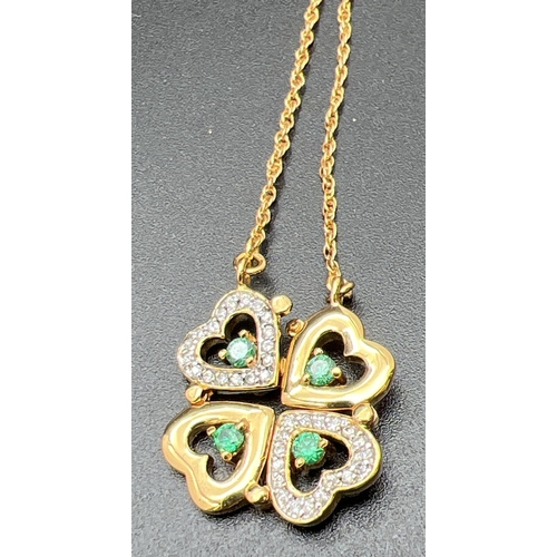 1074 - A Bradford Exchange gold plated fixed pendant necklace set with emeralds & cubic zirconia's. Pendant... 