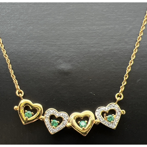 1074 - A Bradford Exchange gold plated fixed pendant necklace set with emeralds & cubic zirconia's. Pendant... 