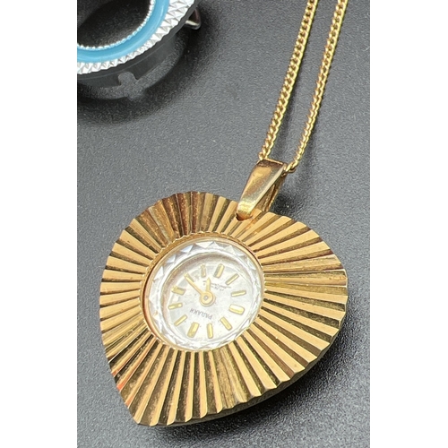 1075 - A vintage 1960's Parakh wind up watch pendant with gold tone heart shaped pendant mount and a 24