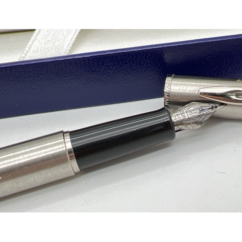 1130 - A boxed Waterman stainless steel cased pen set - fountain pen & ball point pen, together with a box ... 