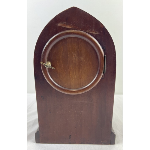 1170 - An Astral, Coventry mahogany cased Gothic style striking mantle clock with inlaid case. Roman Numera... 