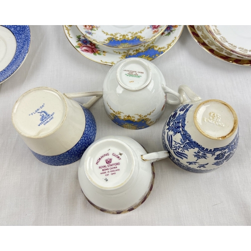 1175 - A collection of 6 assorted ceramic trios to include Wedgwood 'Florida' pattern, 'Morning Glory' from... 