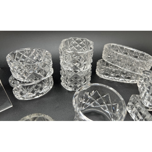 1221 - A collection of lead crystal napkin rings, 9 pairs together with 4 individual napkin rings. In varyi... 