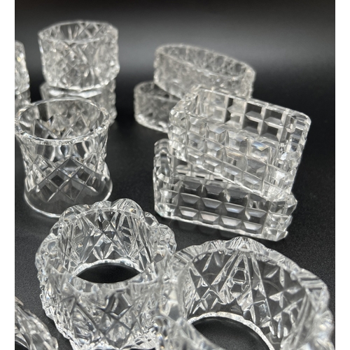 1221 - A collection of lead crystal napkin rings, 9 pairs together with 4 individual napkin rings. In varyi... 