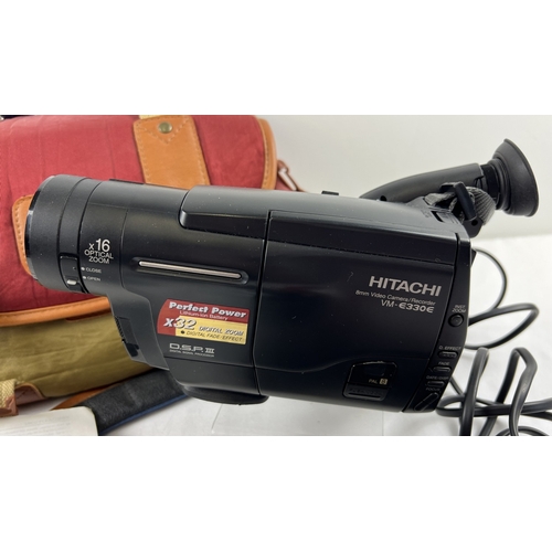 1234 - A Hitachi VM-E330E 8mm Digital zoom video camera/recorder with carry bag and accessories. To include... 