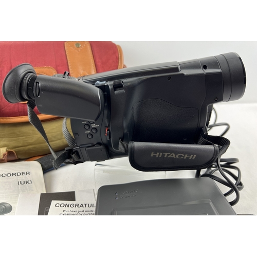 1234 - A Hitachi VM-E330E 8mm Digital zoom video camera/recorder with carry bag and accessories. To include... 