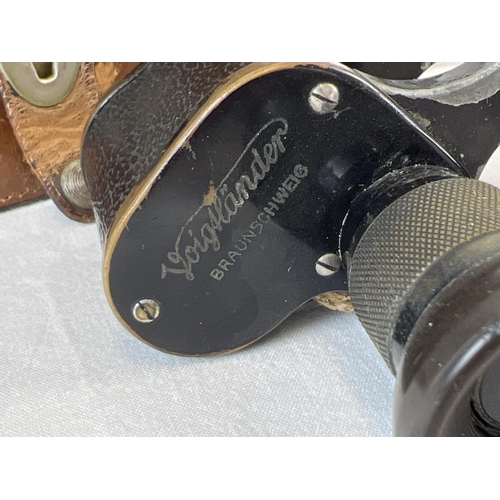 1238 - An antique pair of Victorian c1873 Voigtlander Braunschweig 6 x 24 binoculars with original leather ... 