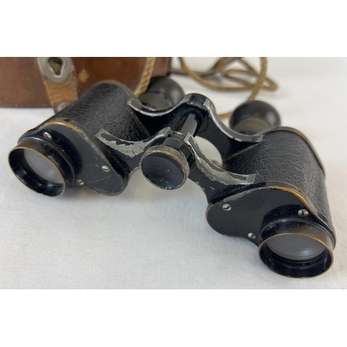 1238 - An antique pair of Victorian c1873 Voigtlander Braunschweig 6 x 24 binoculars with original leather ... 