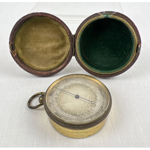 1242 - An antique pocket barometer, Murray and Heath Opticians, Jermyn St, London. In original maroon leath... 