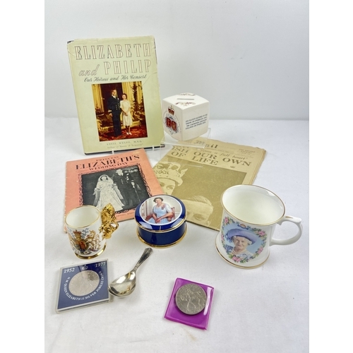 1291 - A collection of Royal memorabilia and ceramics. To include Queen Elizabeth silver jubilee money box,... 