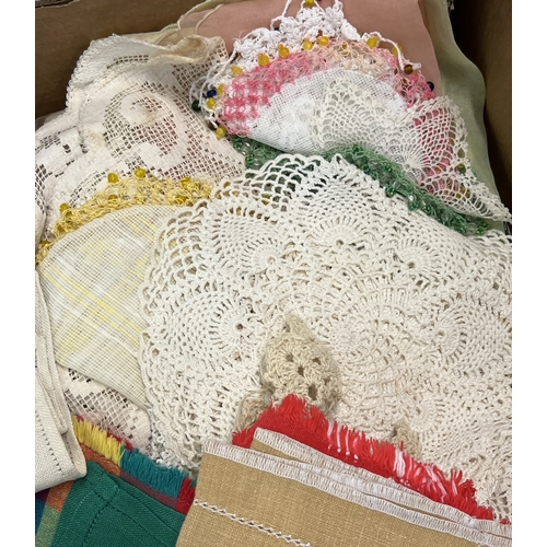 1327 - 2 boxes of assorted vintage table cloths and table linen to include doilies and tray cloths.