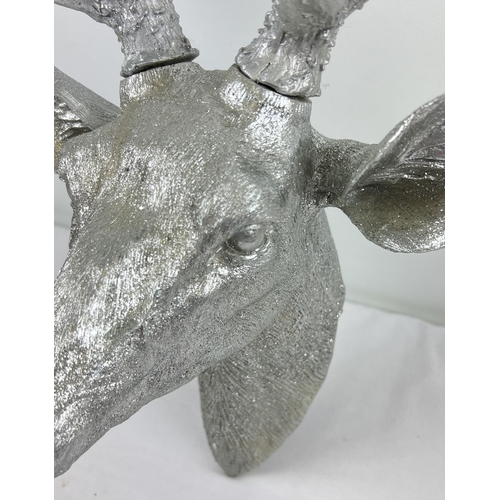 1345 - A large modern resin, wall mountable stags head in glittered silver finish. Approx. 60cm tall.