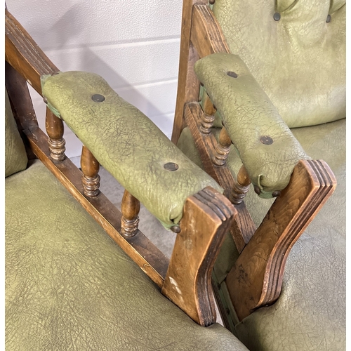 1376 - A pair of Edwardian dark wood framed button backed armchairs with green faux leather upholstery. Rai... 