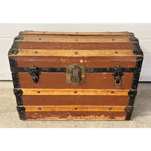 1377 - An antique 2 handled dome topped trunk with wooden banding, studded detail and original brass lock. ... 