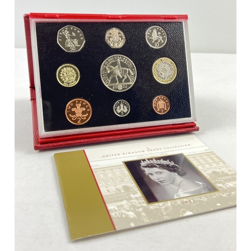 1199 - A cased proof set of 2002 British coins by The Royal Mint. To include Golden Jubilee crown and Stand... 