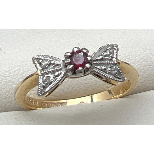 1 - An Art Deco 18ct gold diamond and ruby bow ring. Small central round cut ruby with 1 small diamonds ... 