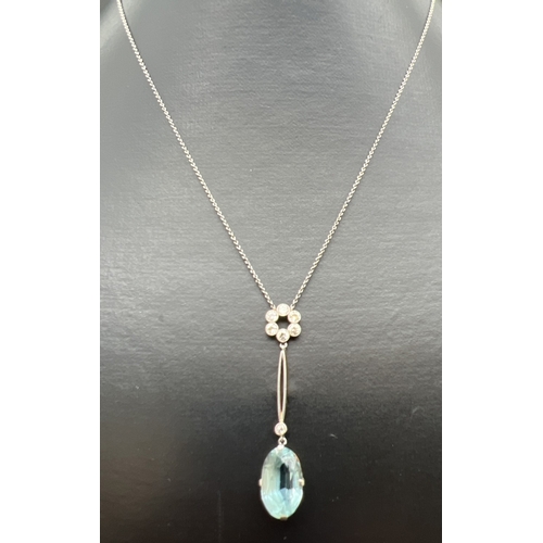 2 - An Art Deco 15ct gold and platinum, aquamarine and diamond pendant necklace. A fine belcher chain fi... 