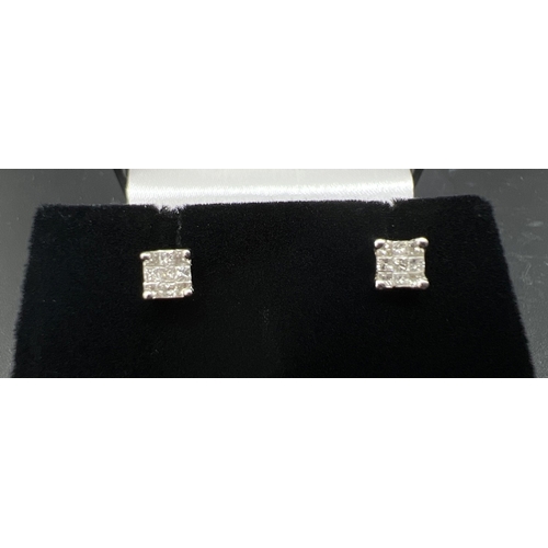 9 - A pair of white gold and 0.5ct diamond square shaped stud earrings. Each earring set with 9 small sq... 