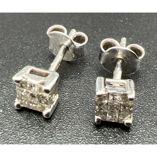 9 - A pair of white gold and 0.5ct diamond square shaped stud earrings. Each earring set with 9 small sq... 