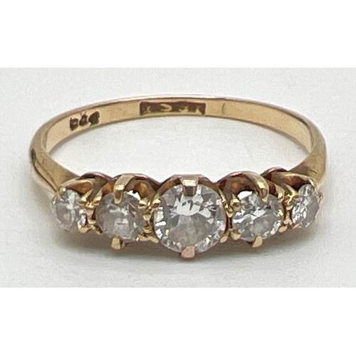 21 - An 18ct gold 0.5ct 5 stone diamond ring with central round cut diamond flanked by 2 graduating size ... 