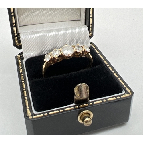 21 - An 18ct gold 0.5ct 5 stone diamond ring with central round cut diamond flanked by 2 graduating size ... 