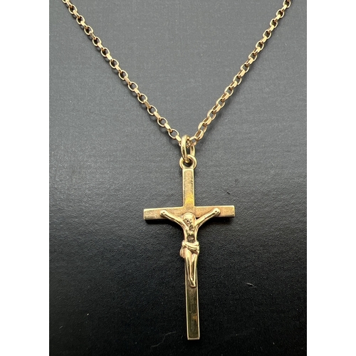 30 - A 9ct gold crucifix pendant on an 18 inch belcher chain with spring ring clasp. Gold marks to back o... 
